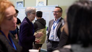 group engaged in conversation at conference
