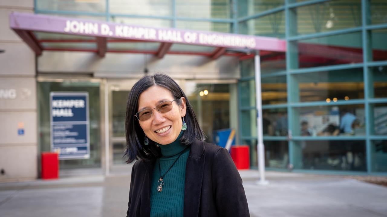 Chen-Nee Chuah stands outside Kemper Hall at UC Davis Campus
